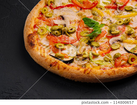 Freshly baked vegetable pizza on black background 114800657