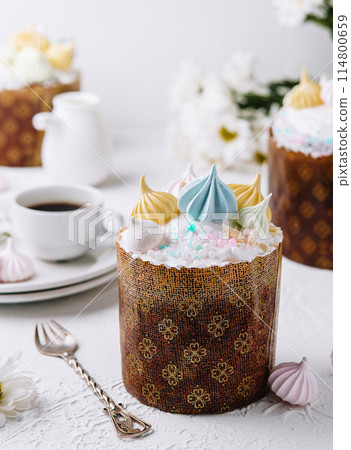 Delicate easter kulich cake with colorful icing Delicate easter kulich cake with colorful icing 114800659