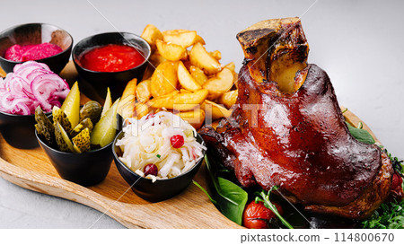 Gourmet roasted pork knuckle platter with sides Gourmet roasted pork knuckle platter with sides 114800670