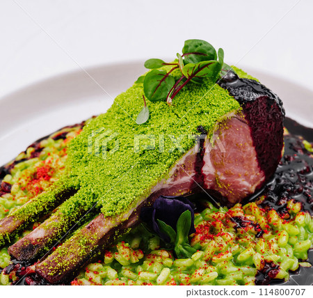Gourmet rack of lamb with herb crust and berry sauce Gourmet rack of lamb with herb crust and berry sauce 114800707