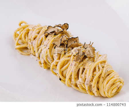 Gourmet truffle pasta on white plate Gourmet truffle pasta on white plate 114800743