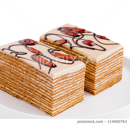 Delectable honey cake slices on white plate 114800763
