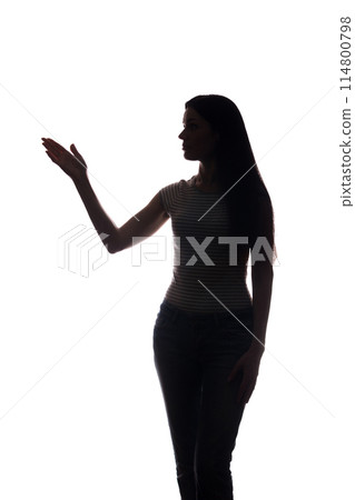 Young woman in suit shows his index finger, hand forward 114800798