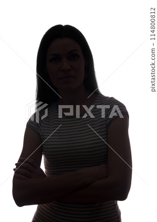 Young woman look ahead with flowing hair - vertical silhouette Young woman look ahead with flowing hair - vertical silhouette 114800812