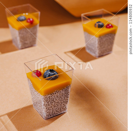 Elegant dessert cups on warm toned background 114800932