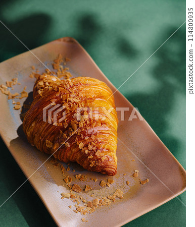Gourmet croissant on ceramic plate Gourmet croissant on ceramic plate 114800935