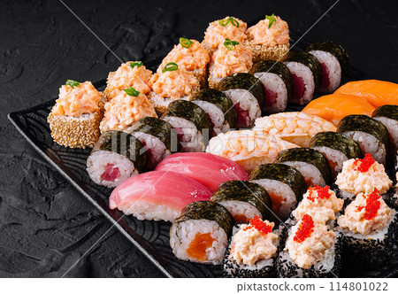 Assorted sushi platter on a black slate Assorted sushi platter on a black slate 114801022