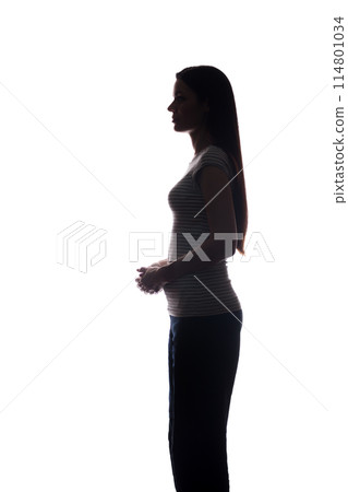 Young woman look ahead with flowing hair - vertical silhouette 114801034