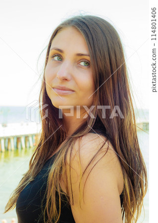 Attractive woman posing on sunny day Attractive woman posing on sunny day 114801406