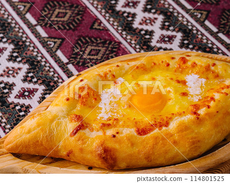 Traditional georgian khachapuri on wooden board 114801525