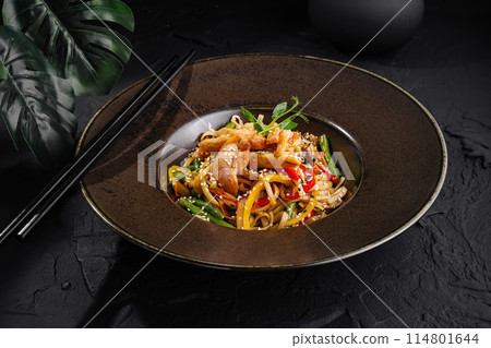 Asian-style stir fry noodles with vegetables and chicken Asian-style stir fry noodles with vegetables and chicken 114801644