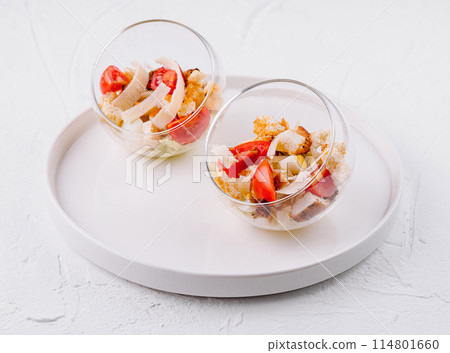 Fresh caesar salad in glass bowls 114801660