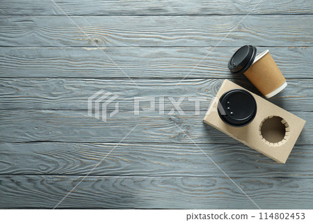 Kraft cups for coffee on a paper stand Kraft cups for coffee on a paper stand 114802453