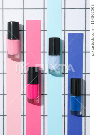 Multicolored nail polishes on a beautiful background 114802508