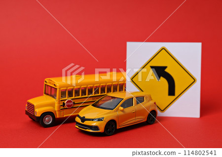 Traffic rules and motor vehicles on a red background. 114802541