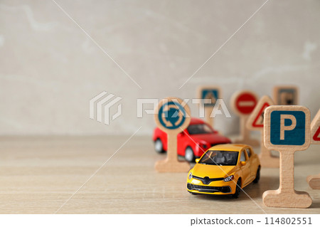 Traffic signs and vehicles on a light background. Traffic signs and vehicles on a light background. 114802551