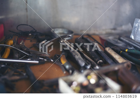 Mechanic tools engineering equipment car auto repair shop with copy space. Blurred background mechanical service. Heavy screw grungy rusted wrenches dirty screwdriver object. Industrial hardware set 114803619