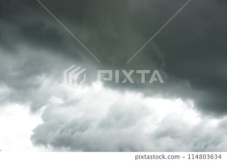 Dramatic dark storm thundercloud rain clouds on black sky background. Dark thunderstorm clouds rainny landscape. Meteorology danger windstorm disaster climate. Dark cloudscape storm disaster gray sky 114803634