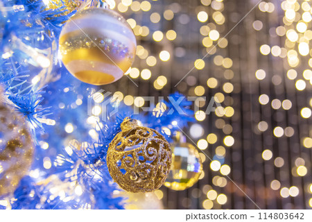 Blurred background golden glitter shiny sparkling banner. Happy Holidays background for template on christmas card brochures posters. Gold bokeh template for digital presentation slideshow background 114803642