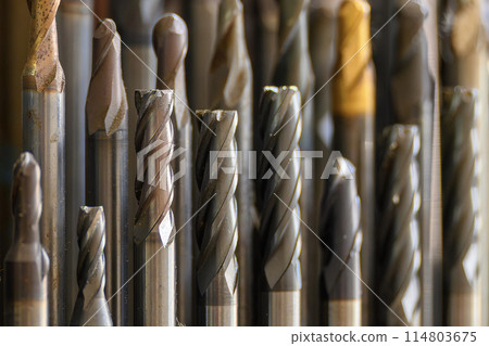 Close-up scene group of the used flat or square solid end mill tools. 114803675