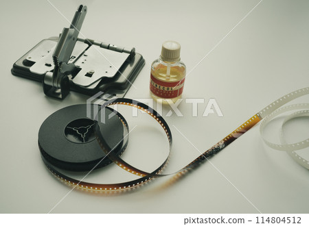 Vintage 8mm moviola cutter with 8mm reel and glue. 114804512