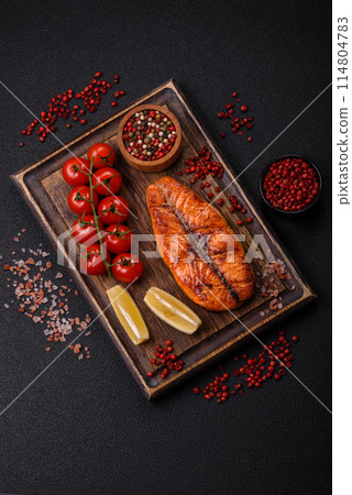 Fresh cooked delicious salmon steak with spices and herbs Fresh cooked delicious salmon steak with spices and herbs 114804783