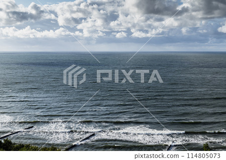 Baltic Sea coastal view with breakwaters and shore water Baltic Sea coastal view with breakwaters and shore water 114805073
