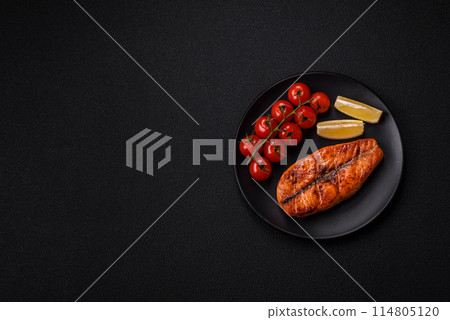 Fresh cooked delicious salmon steak with spices and herbs Fresh cooked delicious salmon steak with spices and herbs 114805120