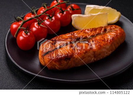 Fresh cooked delicious salmon steak with spices and herbs 114805122