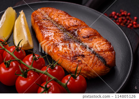 Fresh cooked delicious salmon steak with spices and herbs 114805126