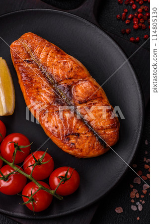 Fresh cooked delicious salmon steak with spices and herbs Fresh cooked delicious salmon steak with spices and herbs 114805130