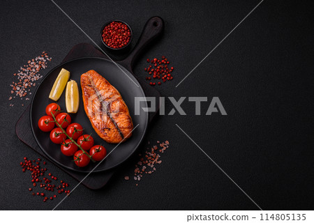 Fresh cooked delicious salmon steak with spices and herbs Fresh cooked delicious salmon steak with spices and herbs 114805135