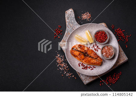 Fresh cooked delicious salmon steak with spices and herbs 114805142