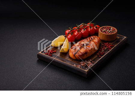 Fresh cooked delicious salmon steak with spices and herbs Fresh cooked delicious salmon steak with spices and herbs 114805156