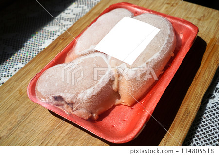 Frozen and packaged fresh chicken meat sold in markets and grocery stores 114805518