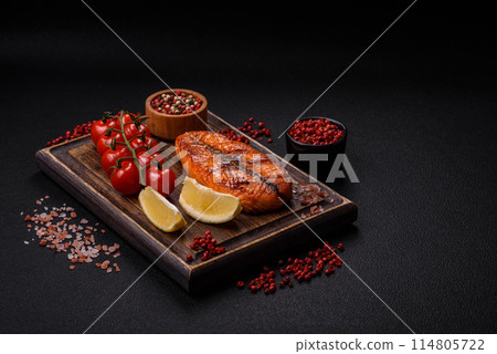 Fresh cooked delicious salmon steak with spices and herbs 114805722