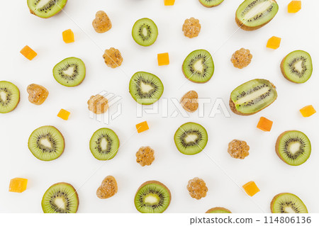 Candied fruit jelly with kiwi fruits on white. Flat lay, top view. Candied fruit jelly with kiwi fruits on white. Flat lay, top view. 114806136