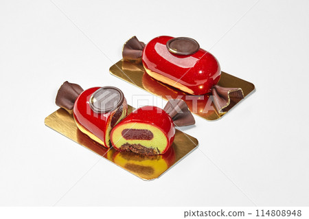 Candy-shaped mousse dessert with berry jelly, chocolate streusel and seal Candy-shaped mousse dessert with berry jelly, chocolate streusel and seal 114808948