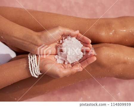 Close-Up Two Holding Hands a Rock of Salt From the Pink Salt Lake Close-Up Two Holding Hands a Rock of Salt From the Pink Salt Lake 114809939