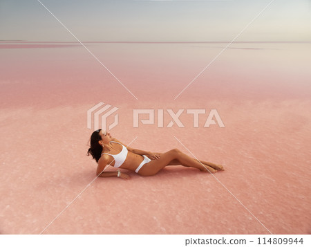 Fashion Bikini Spa Woman Relax on Pink Salt Lake, Beauty Treatment Fashion Bikini Spa Woman Relax on Pink Salt Lake, Beauty Treatment 114809944