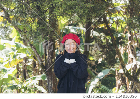 Portrait Asian Woman relaxing in green park. Happy Relax asian woman smiling face at outdoors garden. Young women enjoy nature freedom lifestyle. Greenery wellbeing outside beauty in nature. 114810350