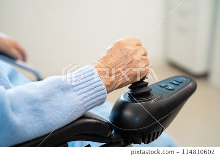 Asian senior woman patient on electric wheelchair with joystick and remote control at hospital, healthy strong medical concept. 114810602