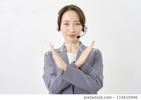 Operator making a cross gesture with his hand on a white background 114810946