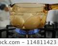 Oily gas stove and boiled eggs 114811423