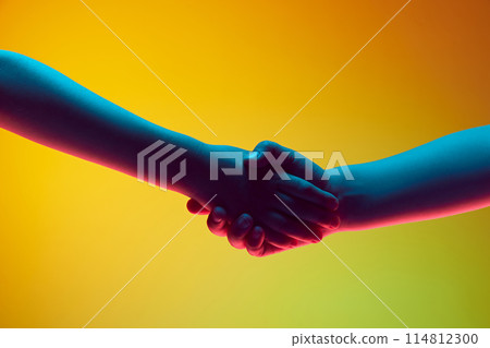 Children hands gesturing, kids shaking hands against gradient green yellow background in neon light. 114812300
