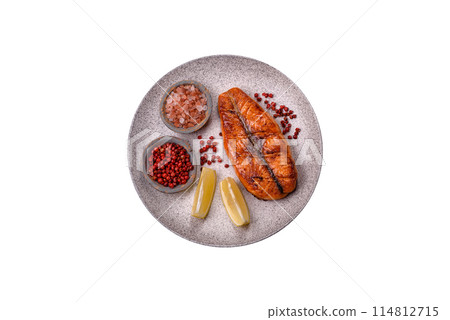 Fresh cooked delicious salmon steak with spices and herbs 114812715