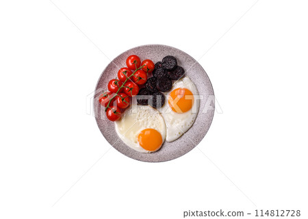 English breakfast with fried eggs, bacon, beans, tomatoes, spices and herbs English breakfast with fried eggs, bacon, beans, tomatoes, spices and herbs 114812728