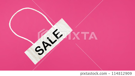 Light tag with the word Sale isolated on a pink background. 114812909