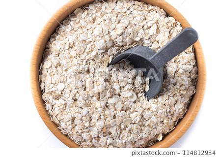 Rolled oats, healthy breakfast cereal oat flakes isolated on white background 114812934