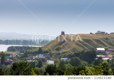 The tower of an ancient Bulgarian fortress on a high cliff on the banks of the Kama River, Elabuga, Tatarstan, Russian Federation 114813180